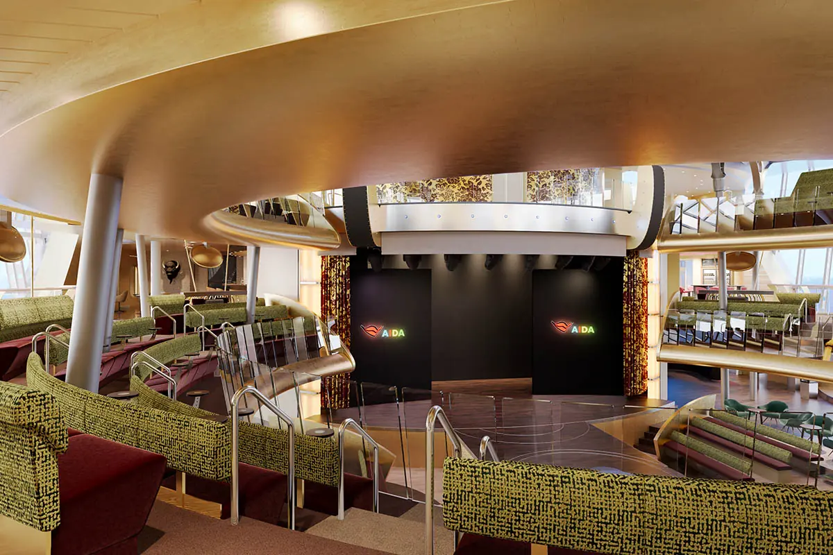 Das Theatrium der AIDAbella mit Bühne, Sitzreihen und modernem Innenraumdesign.